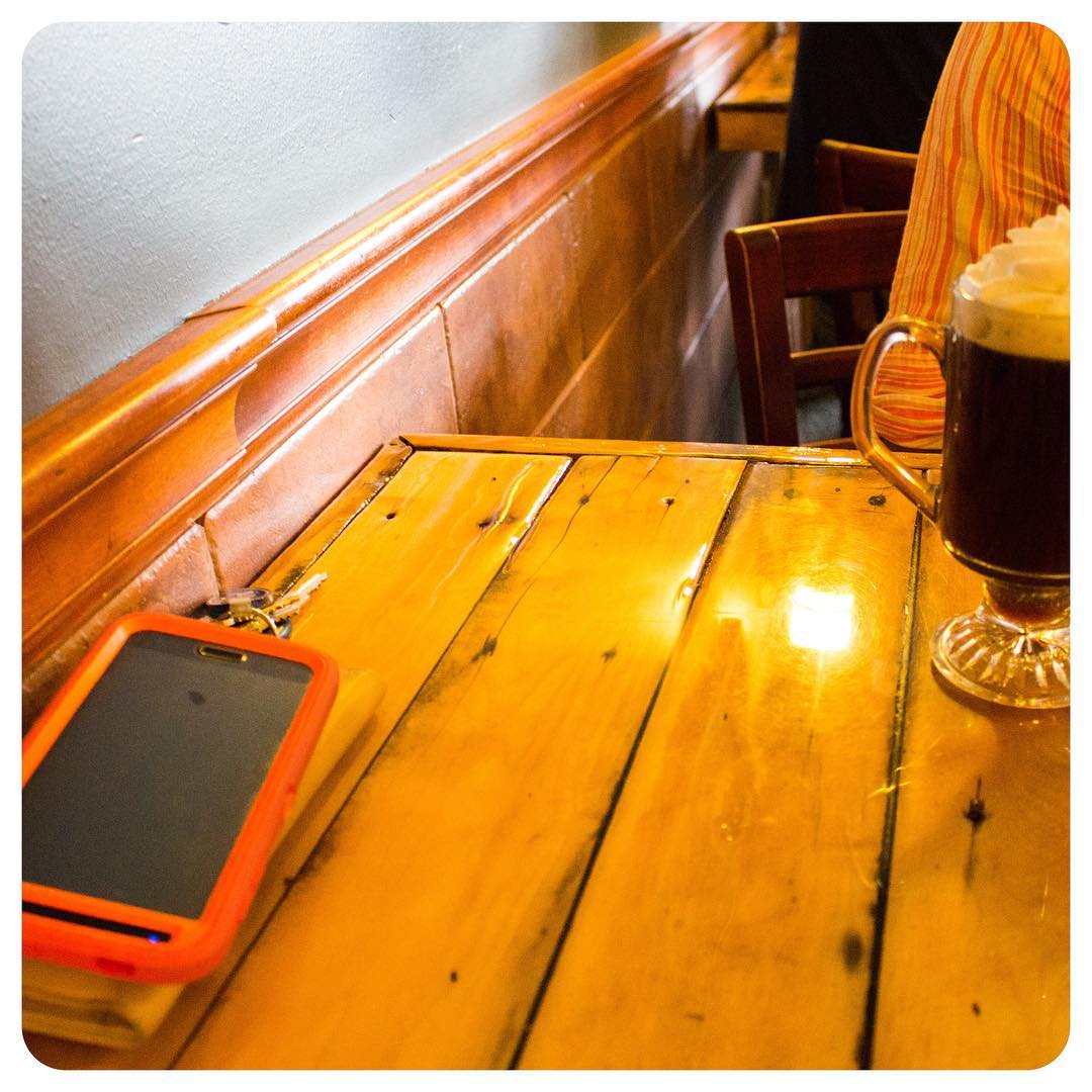 Still life with phone and Irish coffee