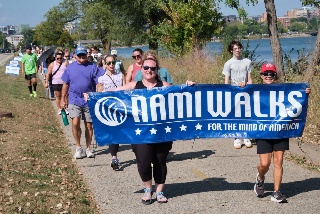 The NAMIWalks banner and walkers during the NAMIWalks Dane County 2025 event in Madison, Wisconsin, on October 4, 2025.